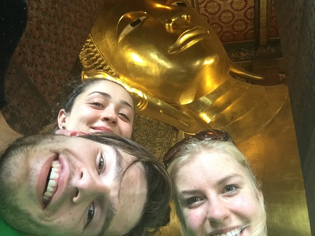 Madison smiles in a group photo with friends