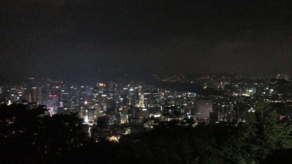 Myeong-dong city is illuminated at night from Namsum Seoul tower