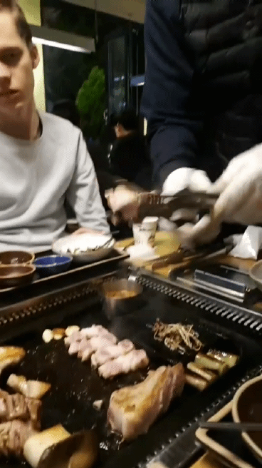 chicken and vegetables being cooked in the hibachi style