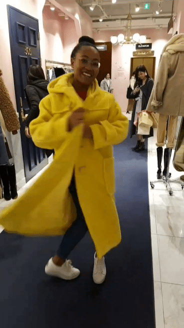 showing off a heavy bright yellow coat