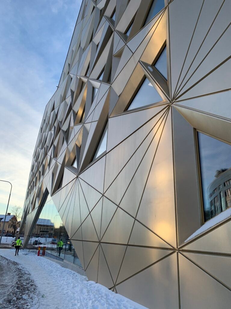 side view of glass and metal building during daytime
