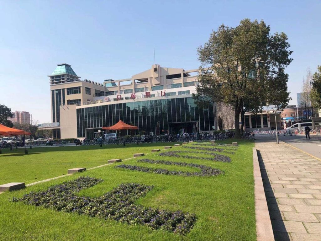 painted letters on grass near building during daytime