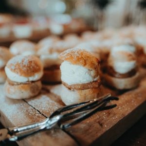 pastries on wooden board near silverware