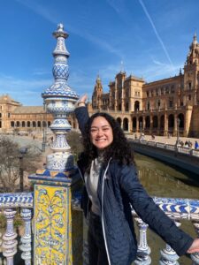 An image of Jazzmyn smiling in front of the Plaza de Espana