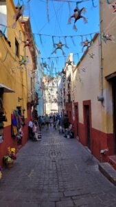 A picture of a decorated, vibrant street in Guanajuato