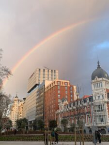 A rainbow arches over the Plaza de Espana