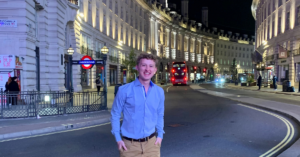 Global ambassador Devin Geelhoed standing in Piccadilly Circus