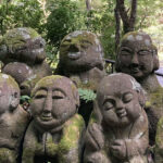 Moss covered stone statues at Otagi Nenbutsu-Ji Temple in Kyoto, Japan