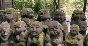 Moss covered stone statues at Otagi Nenbutsu-Ji Temple in Kyoto, Japan