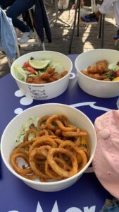 Fish nuggets and calamari on table.