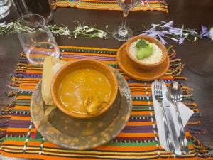 The Guatemalan dish pepián, a thick meat stew, with a corn tamale and rice