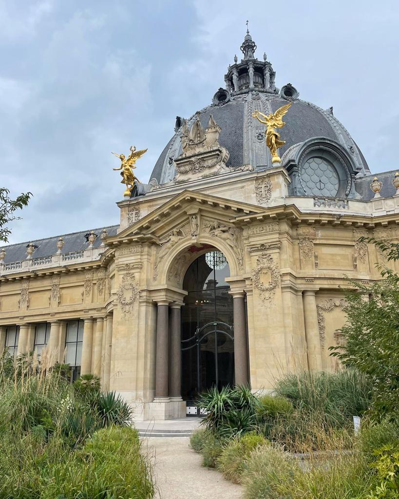 Old French building with dome and golden statues