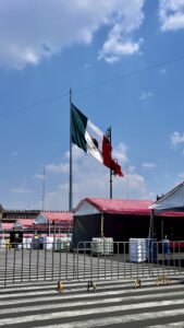 The Mexican flag waves over buildings