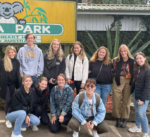 Peyton and friends pose in front of the Koala Park