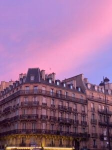 A sunset over buildings