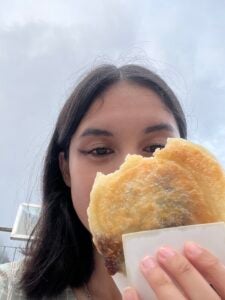 Nina holds up a Korean pancake, called Hotteok