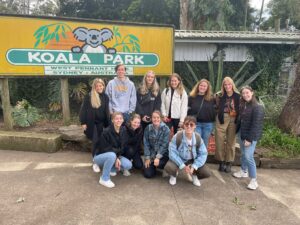 Peyton and friends pose in front of the Koala Park