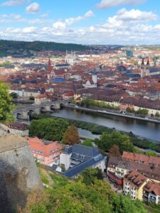 Beautiful red roofed buildings along the river in Würzburg, Germany