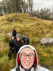 Students take a selfie while hiking in the wet Scottish mountains