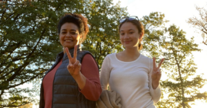 Vanessa and family give the peace sign