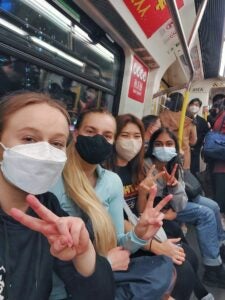 Bhaavya and friends take a selfie on public transportation