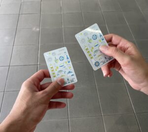 Two individuals show their train tickets at the train station