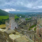 Scenic view from the top turret of Conwy Castle in Conwy, Wales, showcasing the historic architecture, stone walls, and picturesque landscape