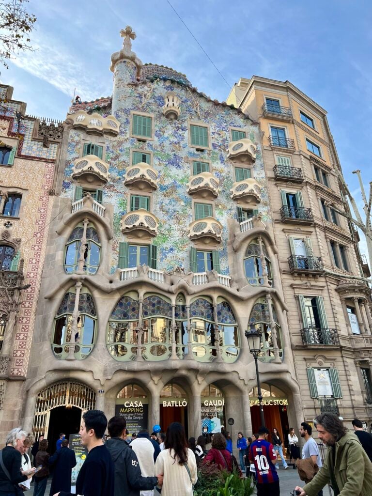 A multi-story building with several windows takes up the full screen