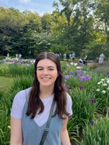 Emma Pardue sitting in a garden