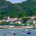 Several boats fill up the bay of a local beach town