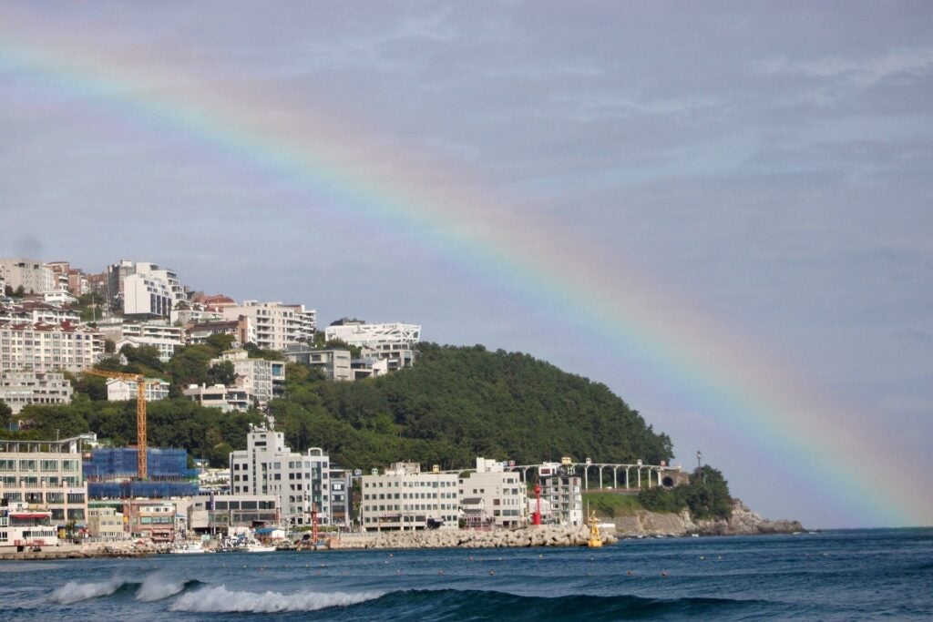 Huge rainbow over the ocean at the beach