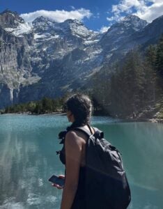 Reaching this point of the hike felt surreal - epic view of high snow covered mountains, pine trees and the rocky coast of an aquamarine blue lake