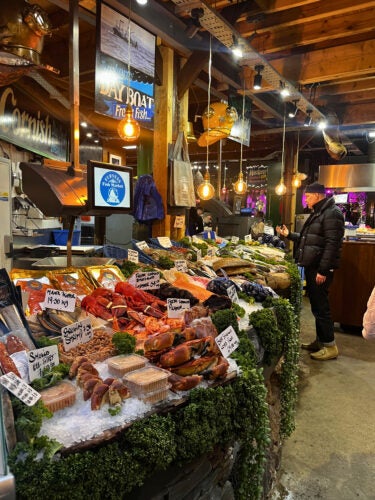 meats and produce line a food market
