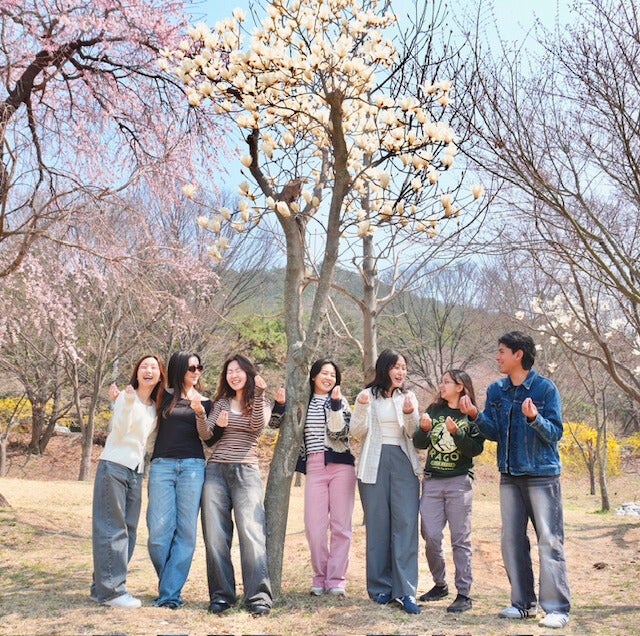 My Spanish Club small group, “Manduz”, posing below cherry trees