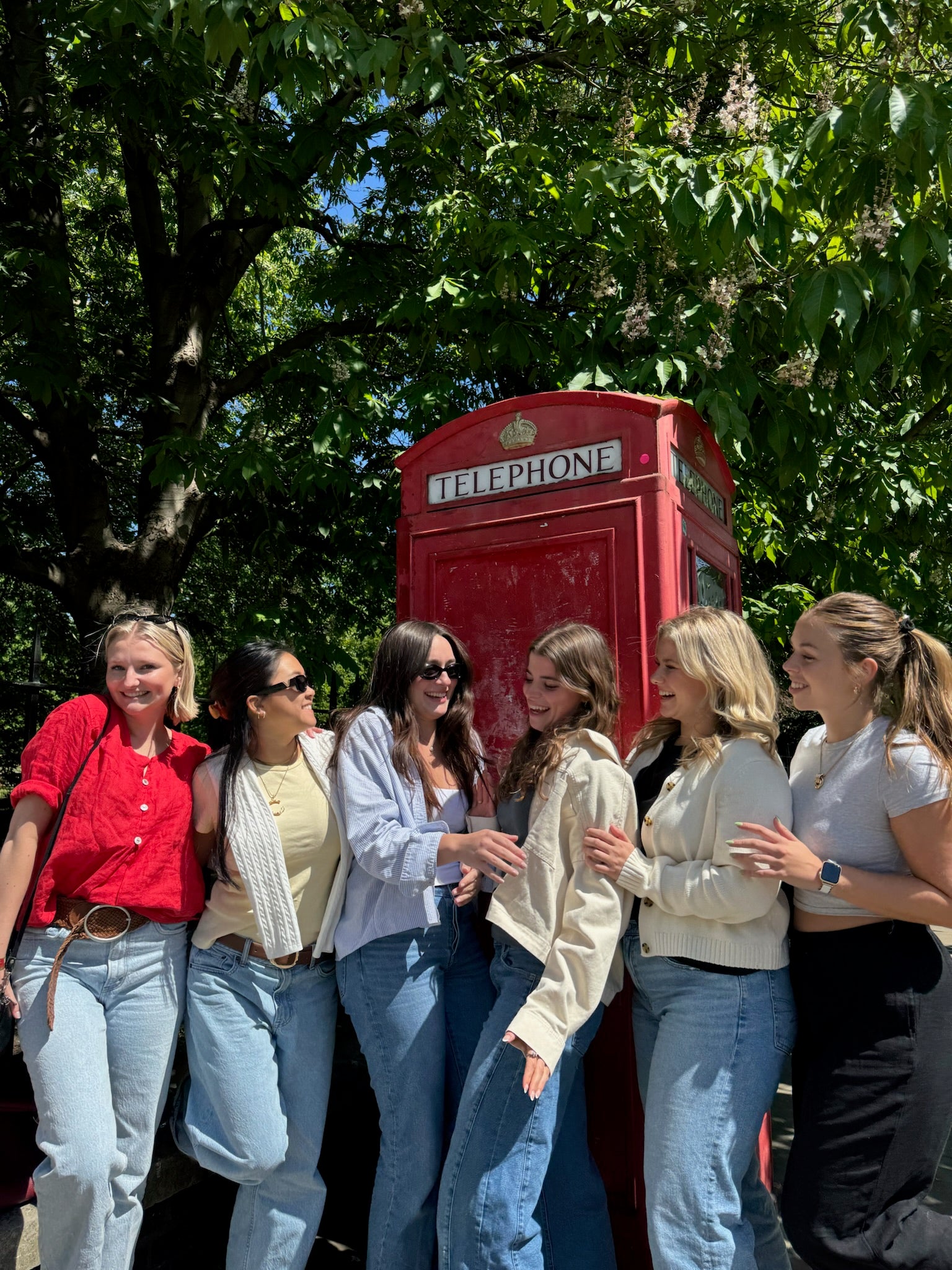 Group shot in front of telephone booths