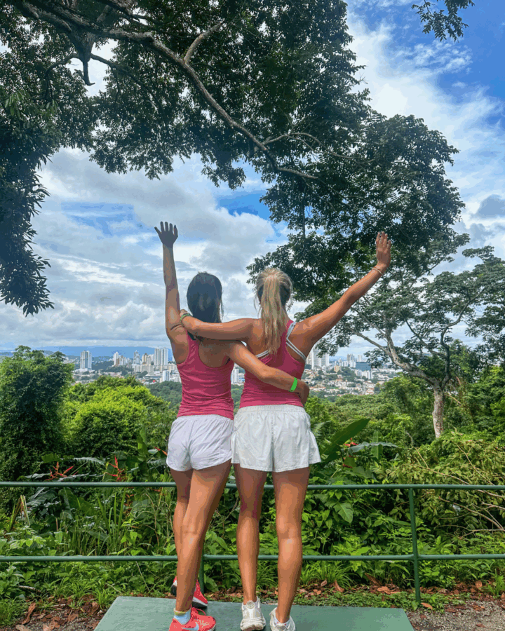Ceila poses with a friend looking towards Panama City on a beautiful day