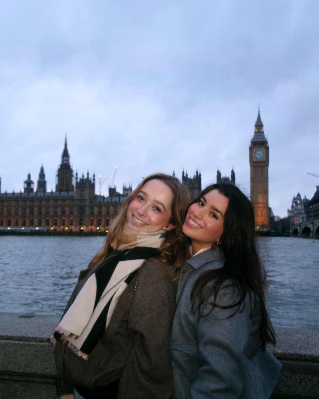 Viviana and a friend pose and smile with the river Thames and famous Big Ben clock tower behind them