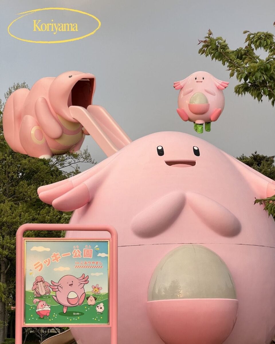 Giant Chansey playground structure in a park with a slide and floating Chansey figure. Sign with colorful Chansey illustration. Playful and cheerful tone.